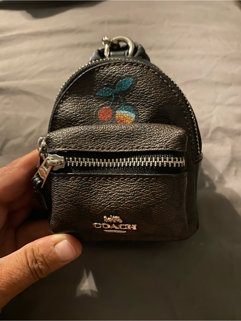 Coach Dark Brown Pebbled Leather Mini Backpack Charm with Teal and Orange Cherry